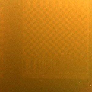 2D slice of the input light field: a tank of murky water between the camera and a checkerboard pattern. Backscatter dominates the image: the orange glow is due to the dim halogen bulb illuminating the scene. 