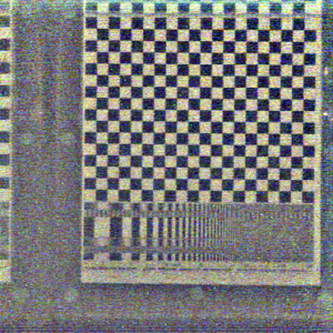 Similar to the previous hyperfan output, but with a narrower depth of field centered on the checkerboard. Here we see how depth of field is traded off for noise performance, similar to a conventional camera, except that here the in-focus elements are described by a tuneable volume instead of a plane.